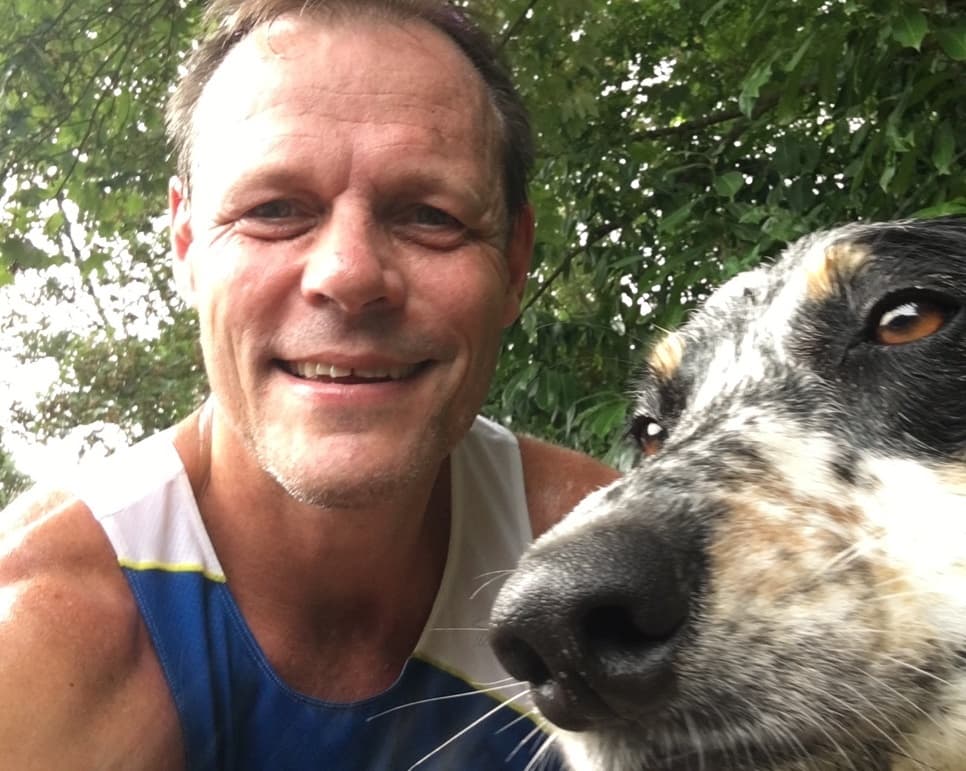 Michael Morrow outdoors with his dog