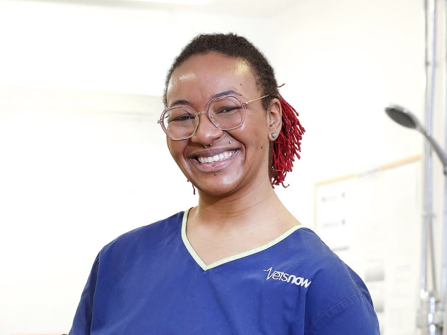 Sadie Spencer, Principal Vet at Vets Now Liverpool, smiling in navy scrubs
